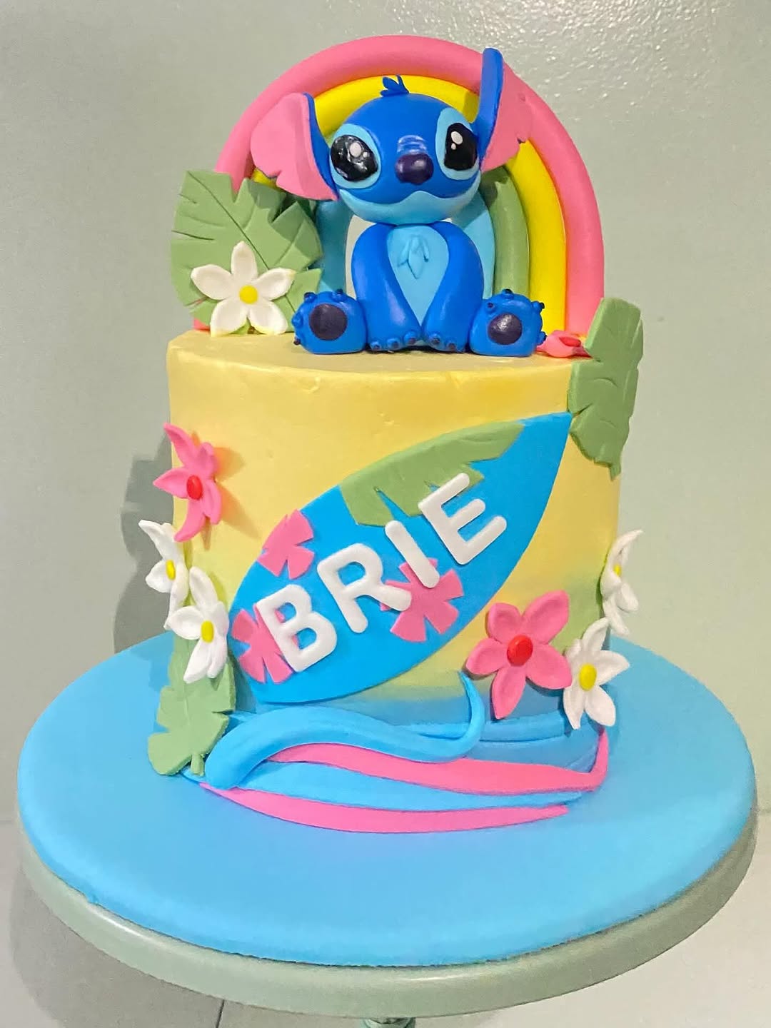 Custom Stitch cake and tropical rainbow decorations